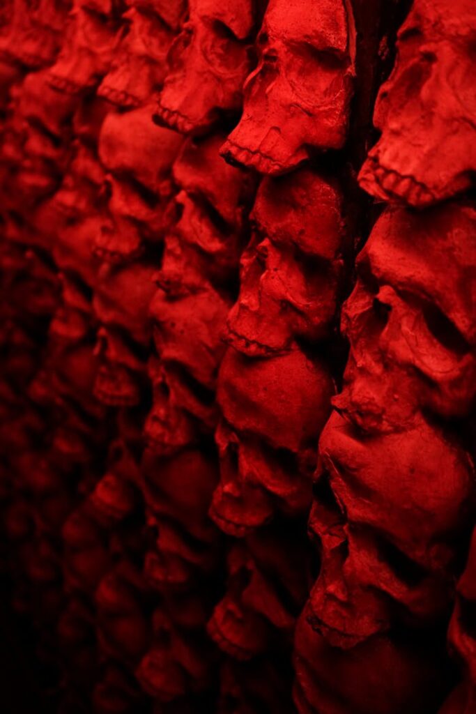 Creepy red skull wall creates a haunting Halloween atmosphere, perfect for spooky backgrounds.